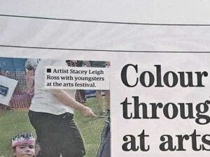 Headline for Royston Crow article about Royston Arts Festival Carnival-like parade showing image of by Leigh artist, Stacey Leigh Ross who held carnival craft workshops for the Royston Museum