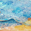 water and waves drawn in a Japanese style with a fish off to the right and lots of textured elements to the bttom of the painting representing waves washing up on a pebbly beige textured shore that sparkles with hints of gold leaf