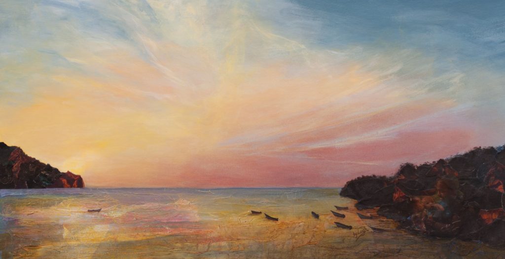 wide landscape of a beach with a vast sky in soft pastel colours of late sunset. Those colours are reflected in the water as a few silhouettes of small fishing boats bob in the surf.