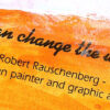 Bright yellow image of a quote from American painter and graphic artist, Robert Rauschenberg that says "Art can change the world"