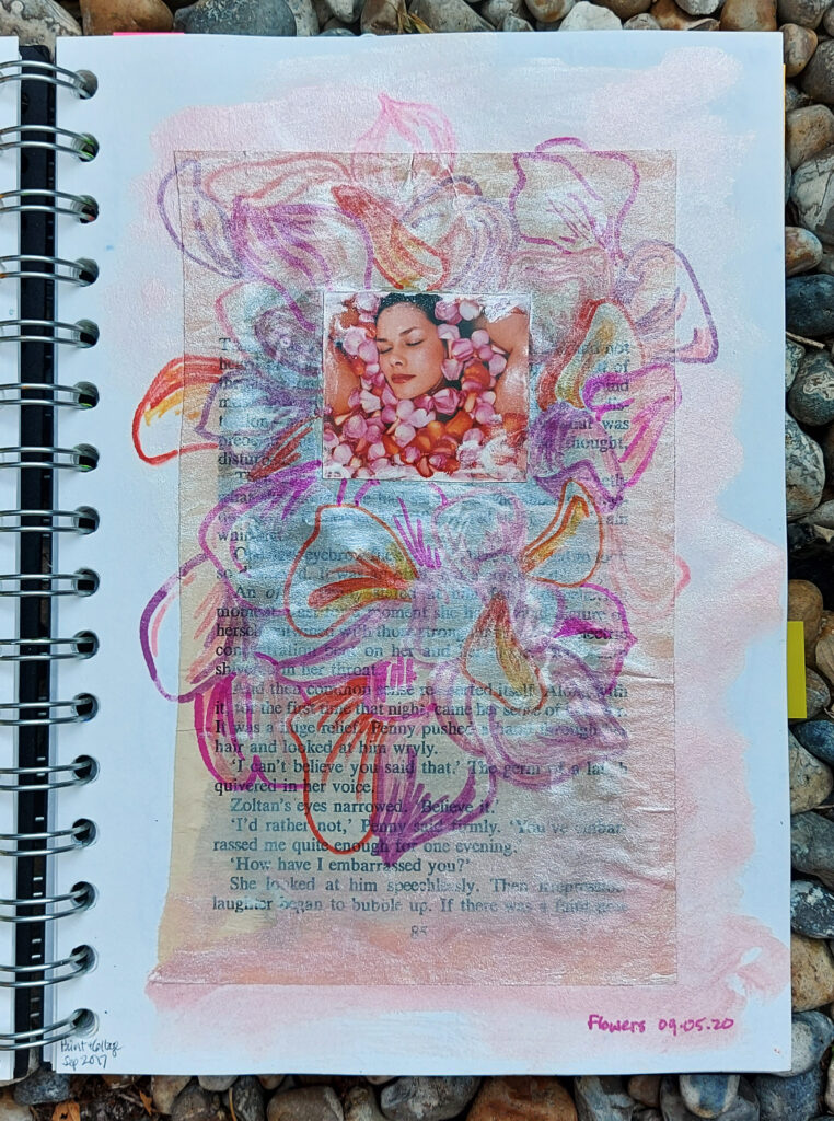 sketchbook collage, ink & sharpies piece showing lots of soft coloured flower petals around the image of a woman's face which is buried among flower petals in a bath