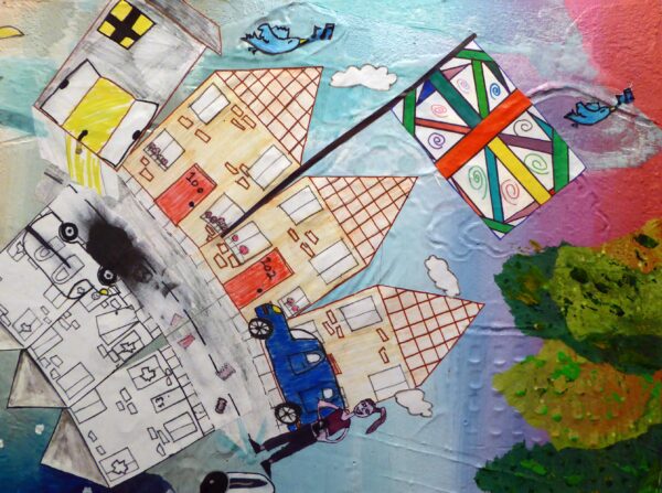 Close up of this Mixed media painting showing artwork from 20 children around the theme 'Changes'. Shown here are close ups of include a colourful diverse Union Jack, and a neighbourhood going from 'good' to 'bad'.