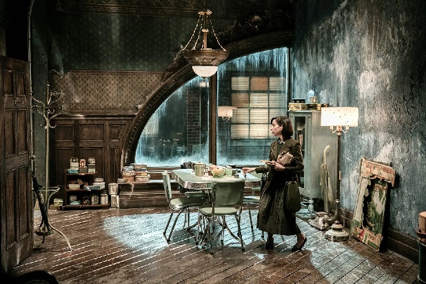 Gloomy water streaked apartment is home to a single woman in the film "The Shape of Water"