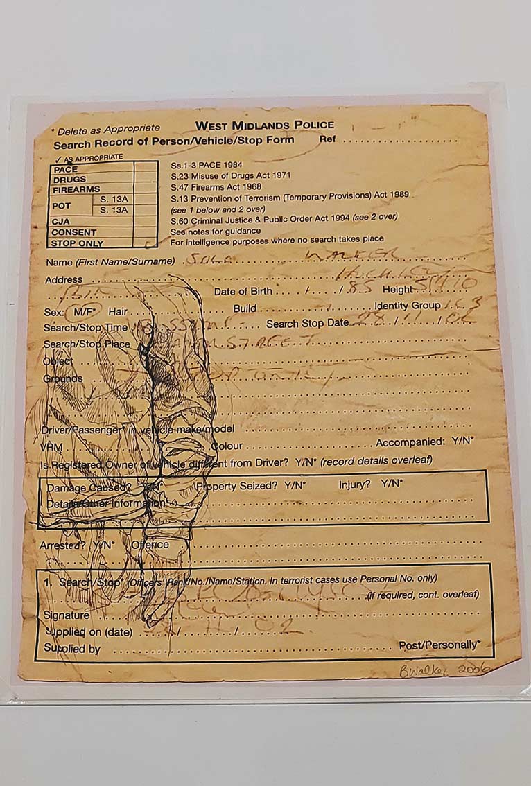 the artist sketches her son on a photocopy of the police forms he receives every time he is stopped and searched. This is sketch 2, form2