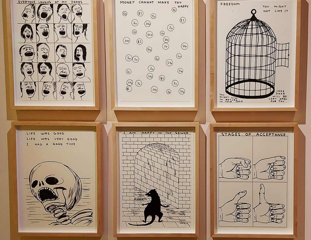 6 wood framed line drawings, black ink on cream paper of different scenes, cartoons and ideas of joy