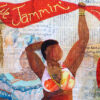 voluptuous dark skinned woman in a beaded bikini in vibrant colours waving a red banner that reads " we jammin still". She appears over a ghostlike woman in blue colonial Caribbean full skirts and blousy top with a headtie.
